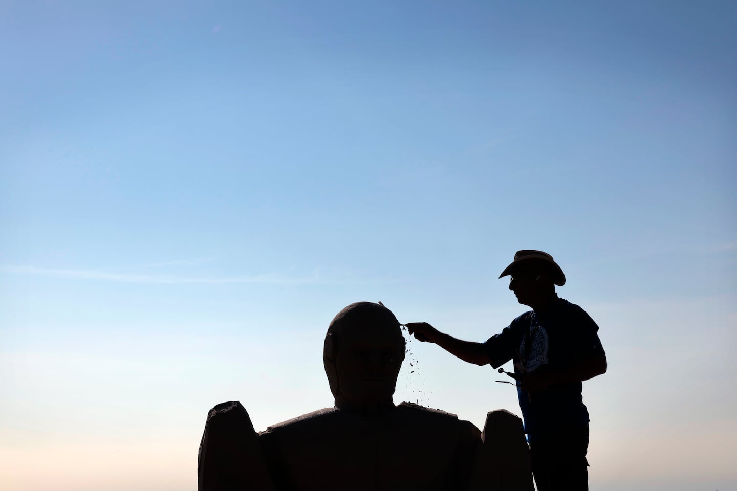 Matthew Deibert, of Smithville, NJ, shaped the head of his piece at Revere Beach.  Of the impermanence of the medium he said, “that’s what’s cool about it. It’s here, people enjoy it, then it’s gone. If you get attached to your art, then sand sculpting wouldn’t be good for you.” 