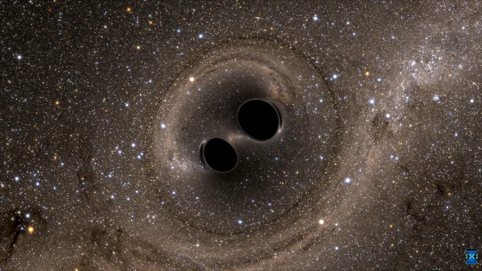 The collision of two black holes - a tremendously powerful event detected for the first time ever by the Laser Interferometer Gravitational-Wave Observatory, or LIGO - is seen in this still image from a computer simulation released in 2016.