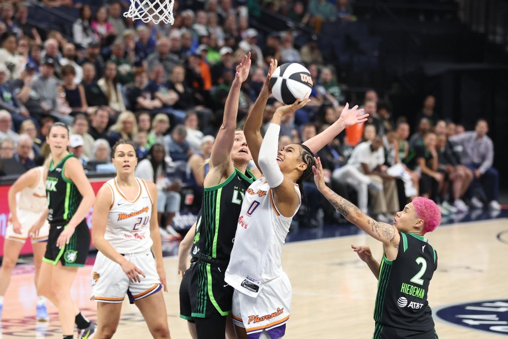 Phoenix Mercury forward Satou Sabally tries to shoot a left-hand layup with Minnesota Lynx forward <a rel=
