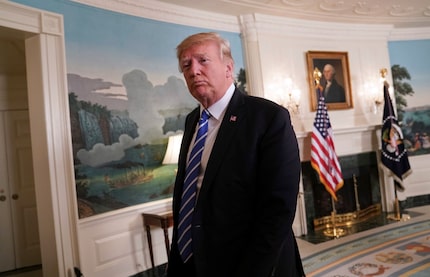 President Donald Trump leaves the podium after speaking in the Diplomatic Reception Room of...