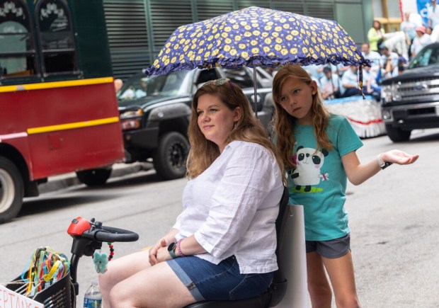 Erin Bernau, left, and her daughter Kaylee Bernau attempt to...