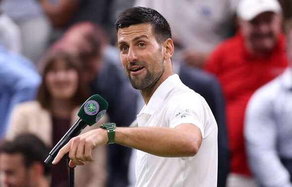 Novak Djokovic speaks into a microphone