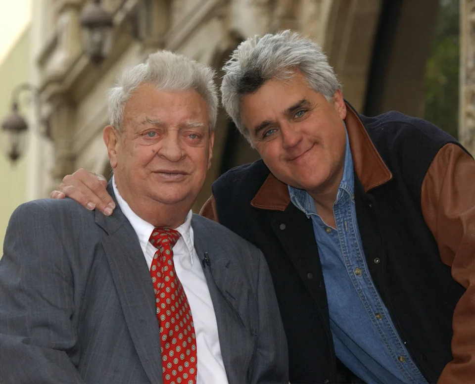 Jay Leno with his hand on Rodney Dangerfield shoulder for photo