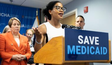 State senator Lydia Edwards shared her thoughts about what would happen if the Medicaid budget was cut during a visit to the Cambridge Health Alliance Revere Care Center in May. State officials, including Governor Maura Healey (left), were at the event.