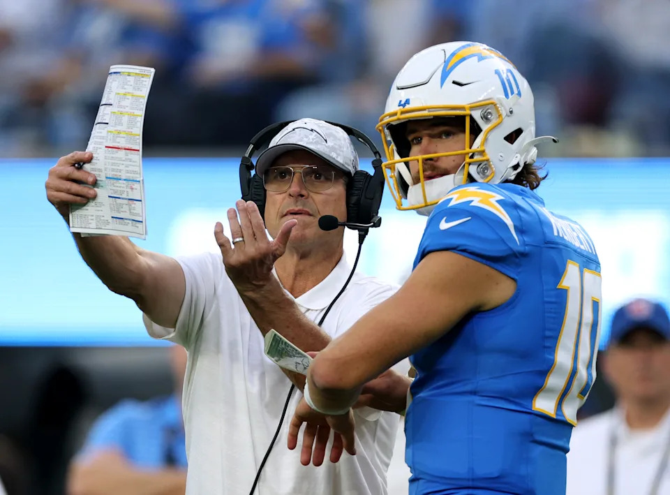 Justin Herbert and Jim Harbaugh helped lead the Chargers to the playoffs in their first season together. (Photo by Harry How/Getty Images)