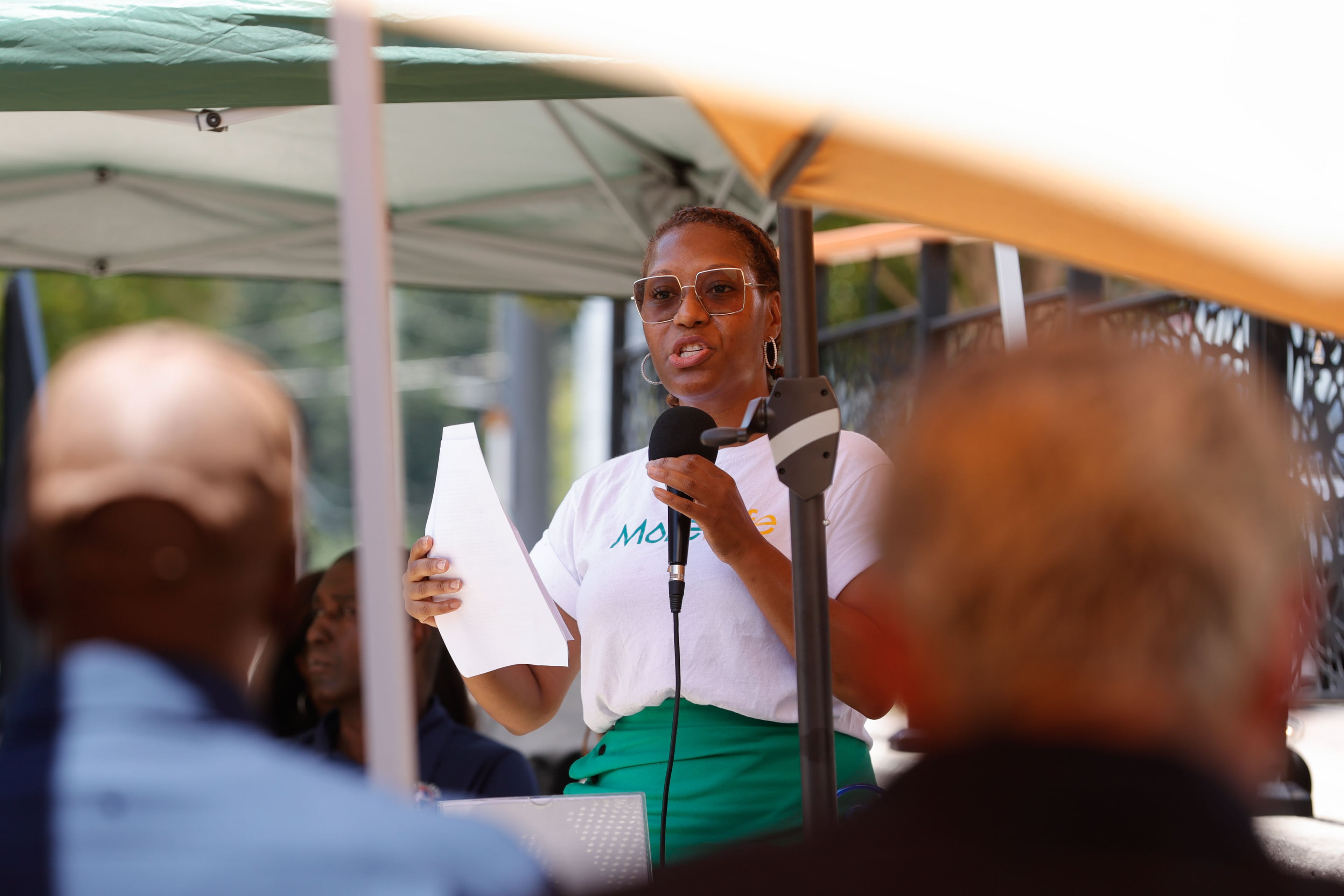 Trinket Lewis, owner of MoreLyfe Juice Co., speaks during a community meeting to present an economic recovery plan and to address damage from prolonged construction in the corridor on Tuesday, July 29, 2025. (Natrice Miller/AJC)