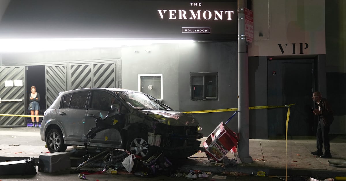 Man whose car struck crowd outside Los Angeles club, injuring 30, was shot, attacked by crowd