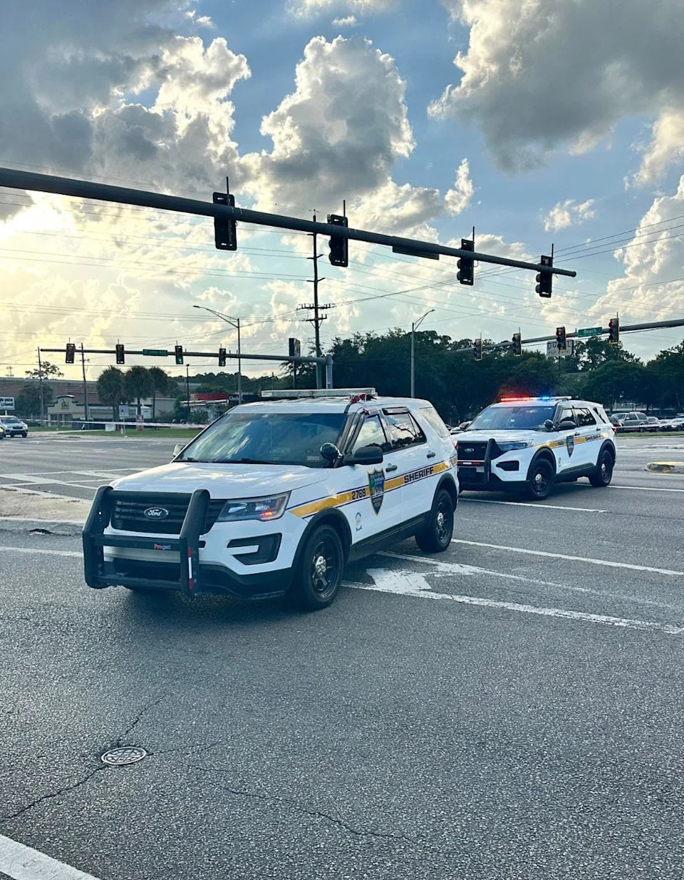 Jacksonville Sheriff's Office police cruisers block Beach Boulevard on Saturday, July 19, 2025, following an officer-involved shooting.