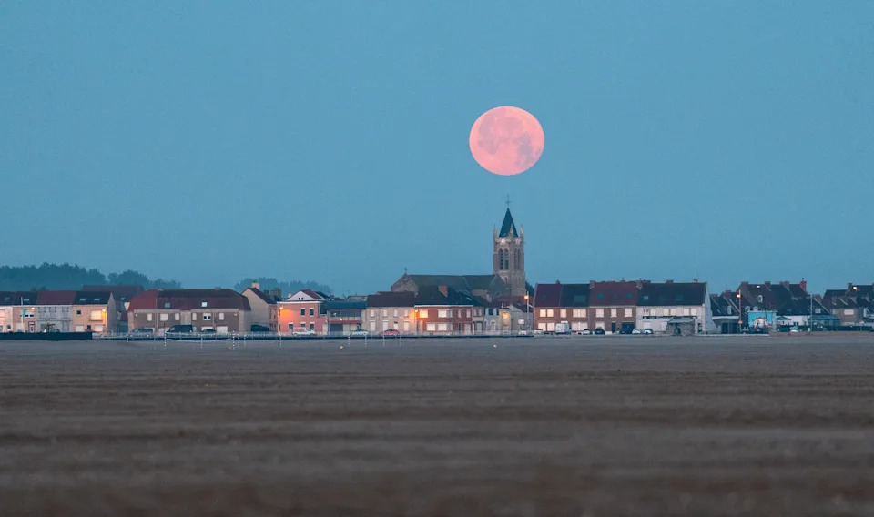 The buck moon hangs over the town of Gravelines, France. (Carl Court/Getty Images)