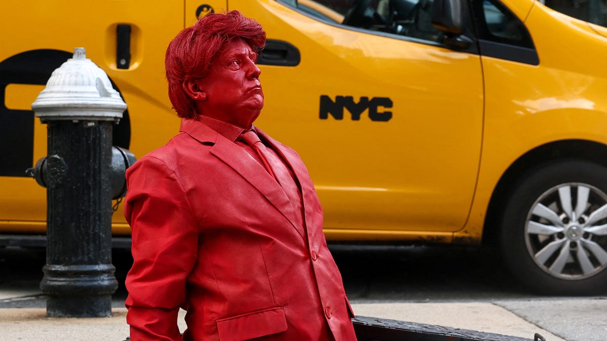 Video shows red sculpture of Donald Trump emerge from a NYC manhole