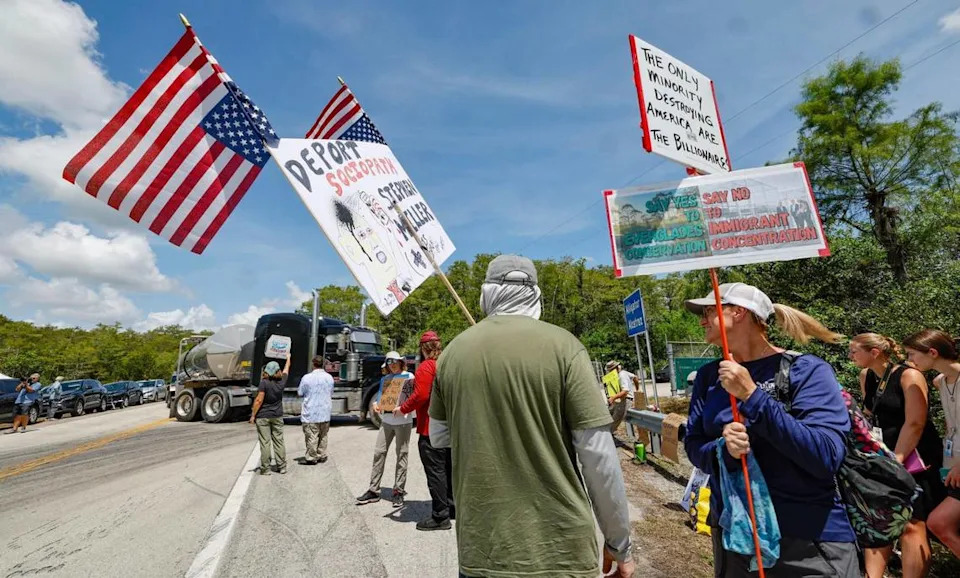 Protesters arrive at the front entrance as Florida lawmakers and members of Congress tour Alligator Alcatraz. The facility is within the Florida Everglades, 36 miles west of the central business district of Miami, in Collier County, Florida Saturday, July 12, 2025.