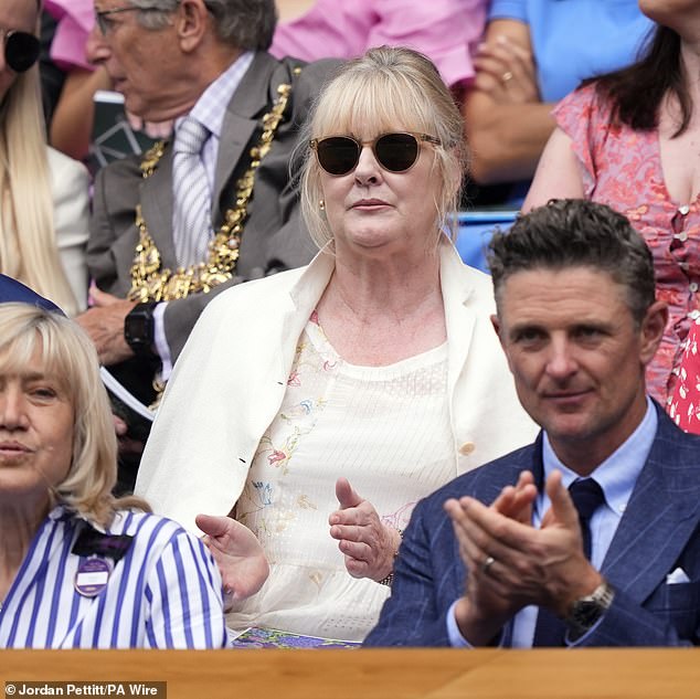 Sarah sported a pair of shades as she watched the tennis in the UK's balmy summer temperatures