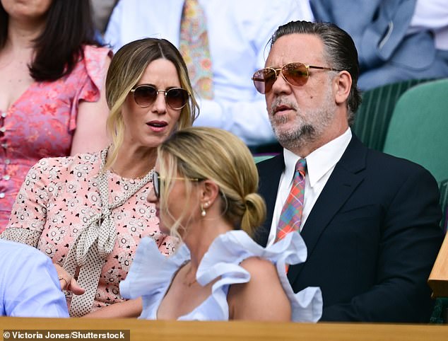 Russell Crowe looked dapper in a suit and tie alongside his fiancée Britney Theriot at Wimbledon today