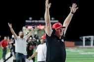 Lovejoy High School head coach Todd Dodge signals the game winning field goal attempt was...