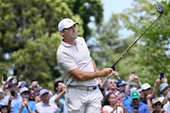 Scottie Scheffler watches his shot from the first tee during the first round of the...