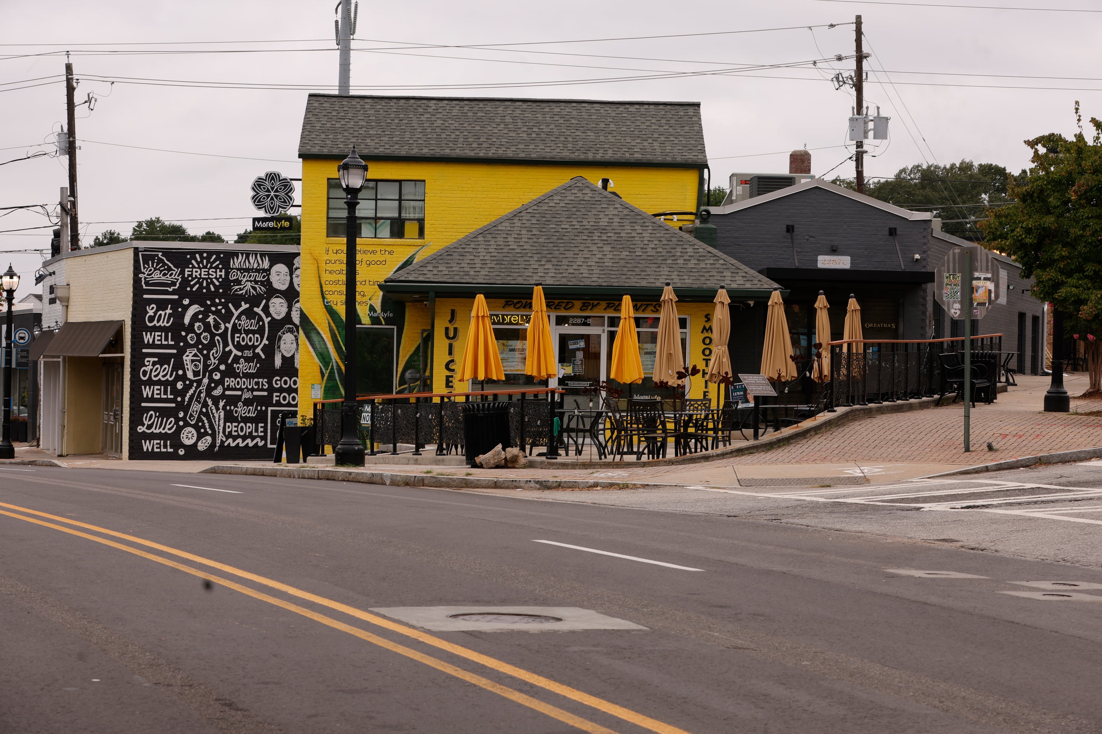 Views of Nourish + Bloom and MoreLyfe Juice Co., small businesses located within the Cascade Heights Business District in Atlanta shown on Tuesday, July 29, 2025. Many business owners in the area say years of construction along Cascade Road and delays have had a negative impact on sales. (Natrice Miller/AJC)