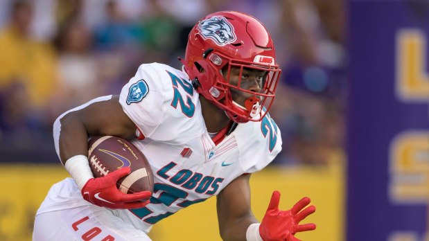 New Mexico running back Christian Washington (22) runs during the first half an NCAA football game against LSU on Saturday, Sept. 24, 2022, in New Orleans. (AP Photo/Matthew Hinton)