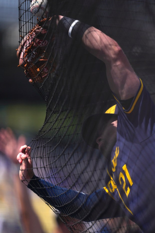Milwaukee Brewers third baseman Caleb Durbin is a able to handle a foul ball hit by Dodgers' Freddie Freeman during the sixth inning of a baseball game Sunday, July 20, 2025, in Los Angeles. (AP Photo/Mark J. Terrill)