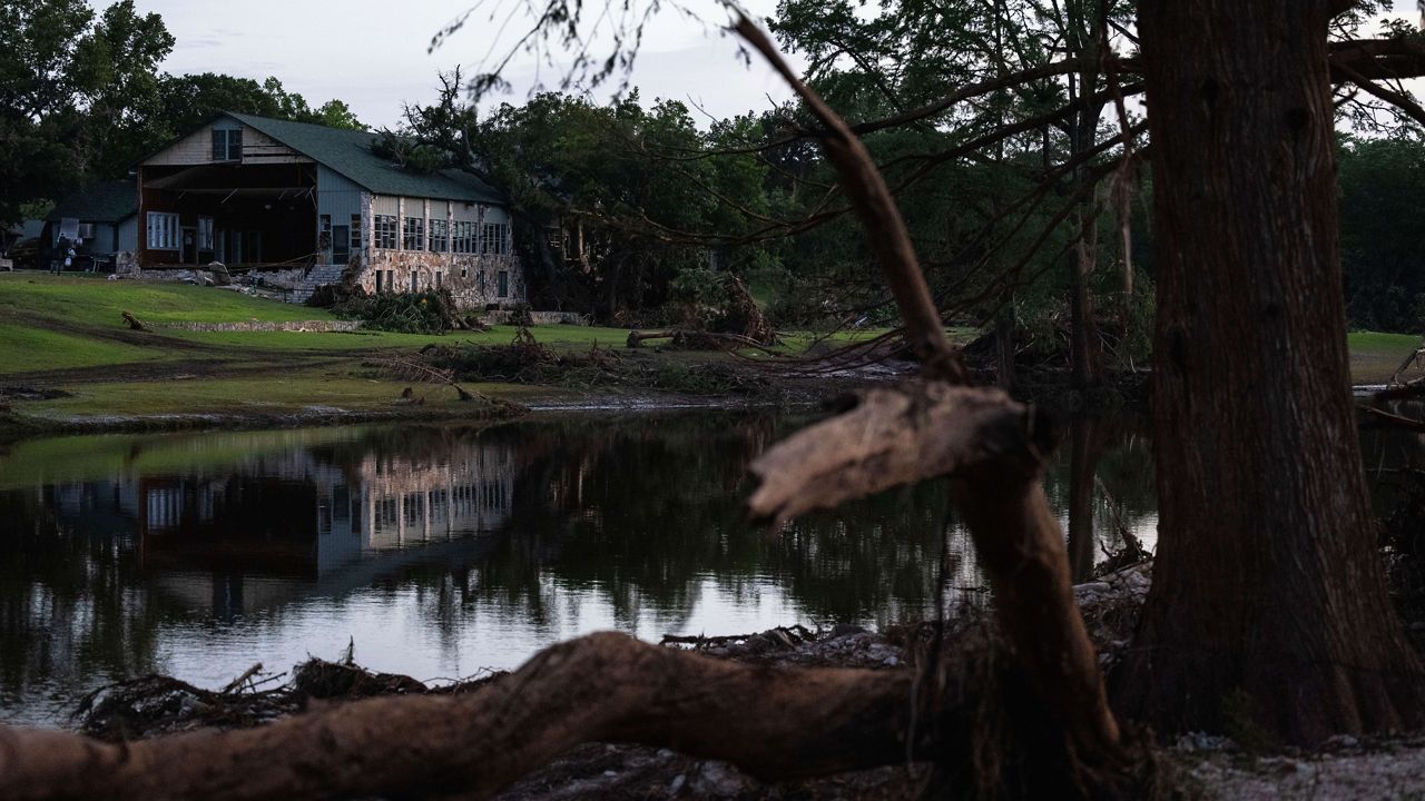 Camp Mystic stands next a creek that feeds into the Guadalupe River, Monday, July 7, 2025, in Hunt, Texas, after flash flooding swept through the area. (AP Photo/Eli Hartman)