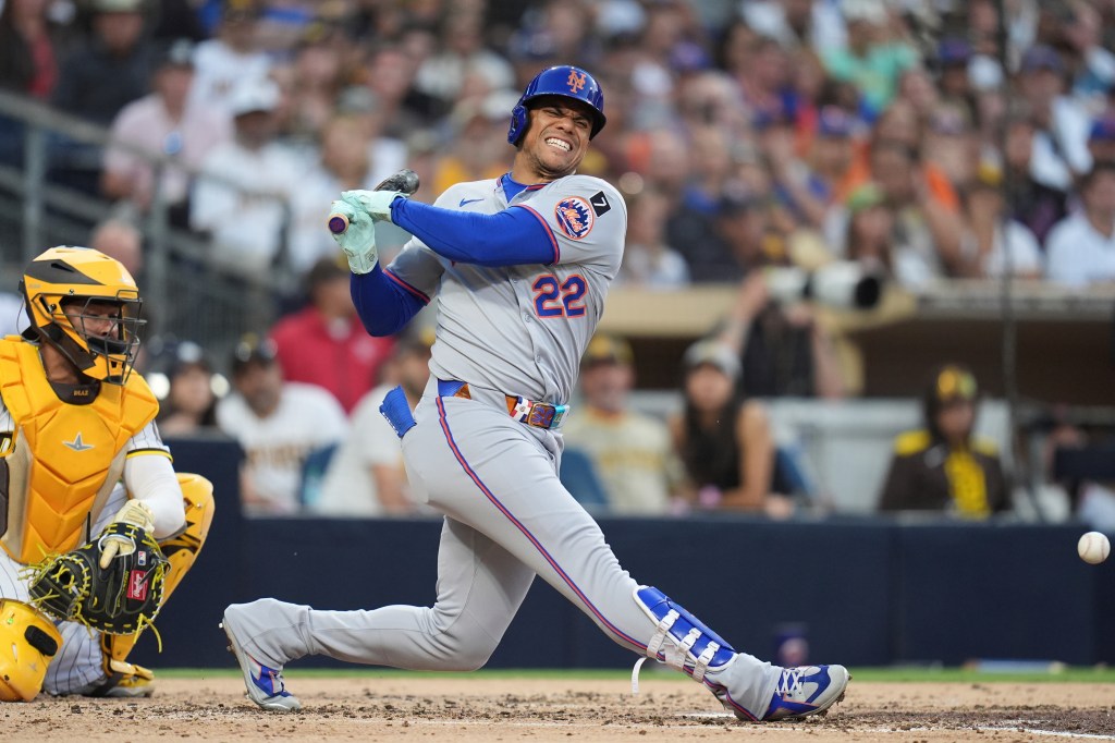 New York Mets' Juan Soto reacts after fouling a ball off his leg while batting during the fourth inning of a baseball game against the San Diego Padres Tuesday, July 29, 2025, in San Diego.