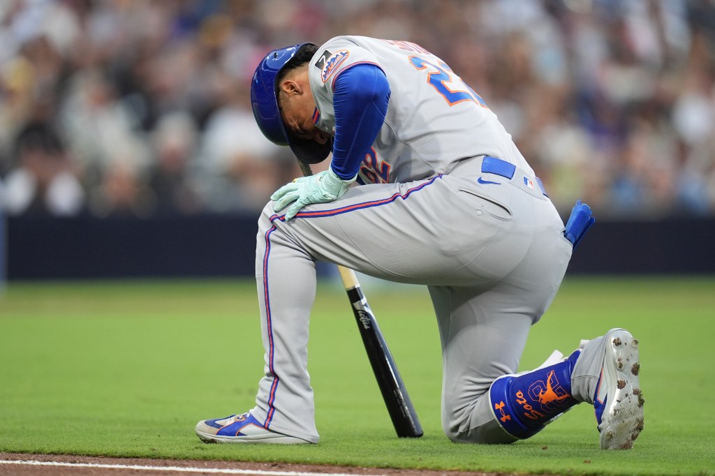 New York Mets' Juan Soto takes a moment after fouling a ball off his leg while batting during the fourth inning of a baseball game against the San Diego Padres Tuesday, July 29, 2025, in San Diego.