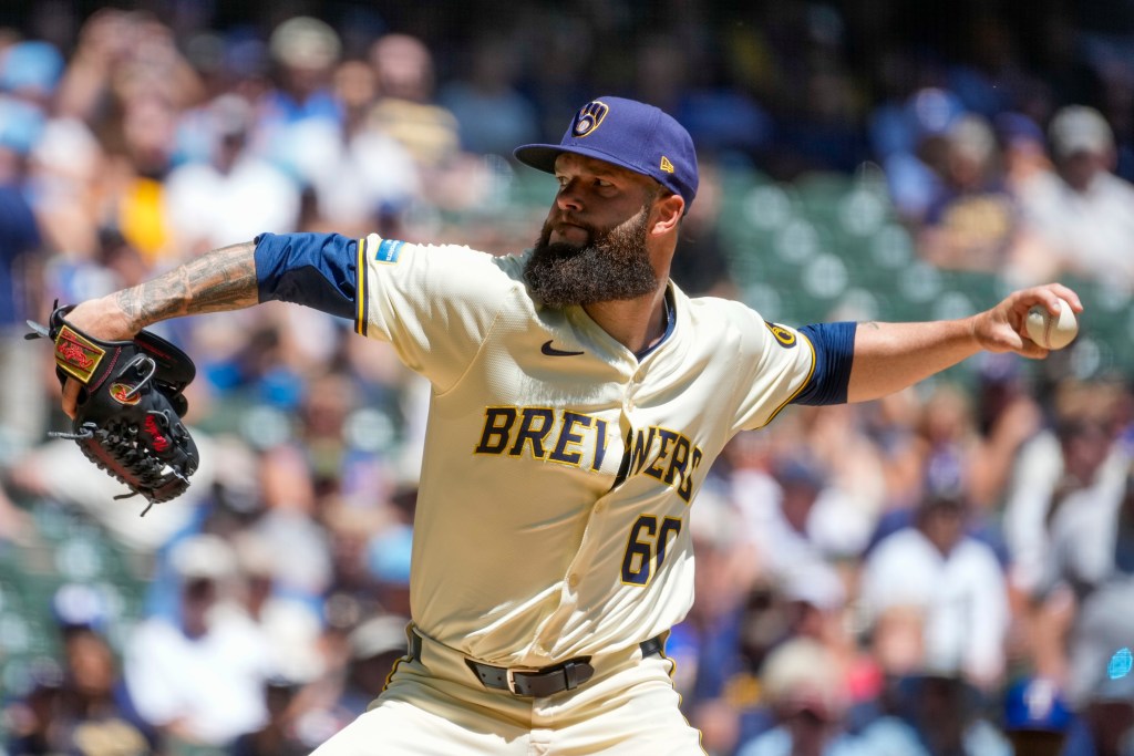 Baseball player pitching a ball.