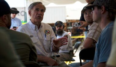 Texas Gov. Greg Abbott speaks to residents and volunteers before a press conference on Tuesday, July 8, 2025, in Hunt, Texas. (AP Photo/Eli Hartman)