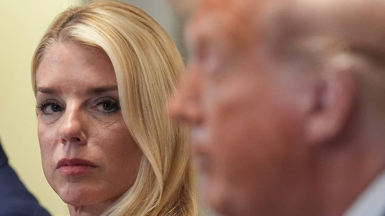 Attorney General Pam Bondi, left, listens as President Donald Trump, right, speaks during a cabinet meeting at the White House on Tuesday, July 8, 2025. (AP Photo/Evan Vucci)