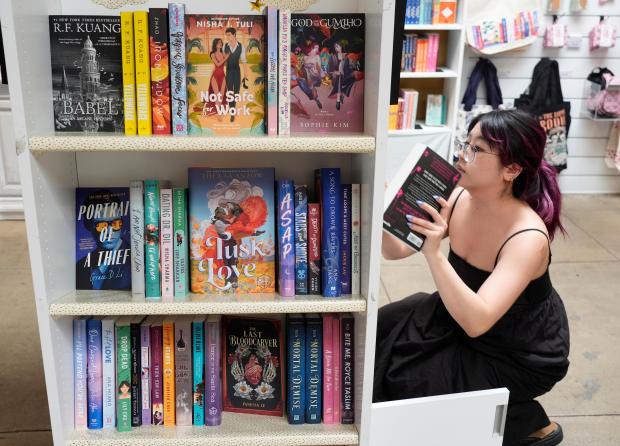 Ashley Dang, an employee at The Ripped Bodice, stocks romance...
