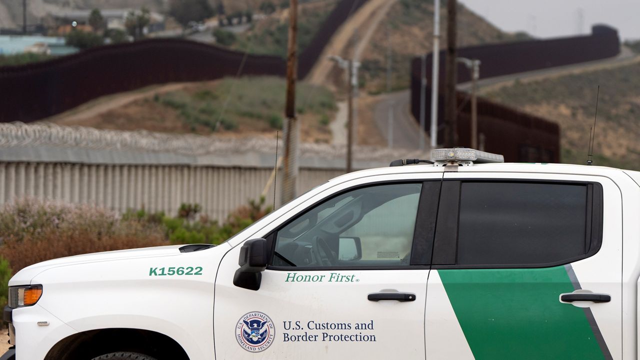 A Border Patrol vehicle sits near border walls separating Tijuana, Mexico, from the United States, Tuesday, June 4, 2024, in San Diego. (AP Photo/Gregory Bull)