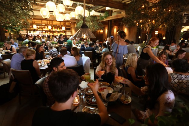 Clockwise from bottom left: Quinn Sharp, Nehal Sheth, Lenel Sheth and Danielle Lichman dine at Aba on Aug. 14, 2018. (Terrence Antonio James/Chicago Tribune)