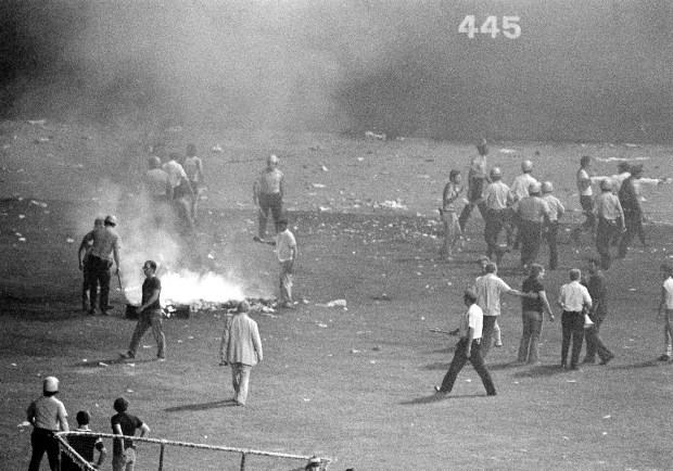 Chicago police disperse a crowd in center field of Chicago's White Sox Park after hundreds of disco records were blown up between games of a doubleheader between the White Sox and the Detroit Tigers on July 12, 1979. Some 7,000 fans of a 50,000-fan crowd jammed the field during an Anti-Disco promotion sponsored by a local radio station. The second game had to be called when umpires ruled the field unfit for play. (Fred Jewell/AP)