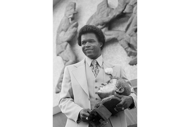 In this July 30, 1977, file photo, former Chicago Bears star Gale Sayers poses after his induction into the Pro Football Hall of Fame in Canton, Ohio. Nicknamed "The Kansas Comet" and considered among the best open-field runners the game has ever seen, Sayers died on Sept. 23, 2020. (AP)