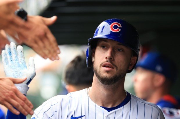 Cubs left fielder Kyle Tucker is congratulated after scoring on an RBI single from center fielder Pete Crow-Armstrong in the first inning against the Cardinals at Wrigley Field on July 6, 2025, in Chicago. (John J. Kim/Chicago Tribune)