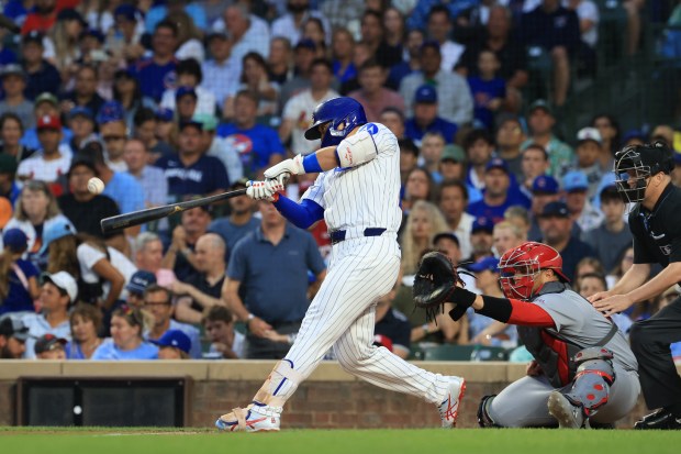 Cubs designated hitter Seiya Suzuki connects on an RBI double in the third inning against the Cardinals at Wrigley Field on July 6, 2025, in Chicago. (John J. Kim/Chicago Tribune)