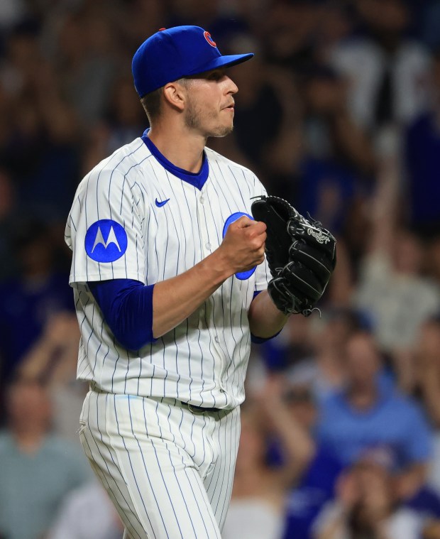 Cubs pitcher Chris Flexen punches his fist into his glove after throwing in the tenth inning against the Guardians at Wrigley Field on July 3, 2025, in Chicago. (John J. Kim/Chicago Tribune)
