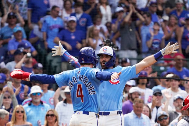 The Cubs' Dansby Swanson, right, is greeted by Pete Crow-Armstrong (4) after hitting a two-run home run against the Cardinals during the seventh inning Friday, July 4, 2025, at Wrigley Field. (AP Photo/David Banks)