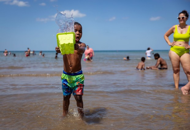 Masiah Stallworth, 4, cools off in Lake Michigan on June...