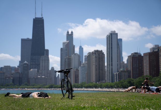 Daniela Griffin rests in the grass after a bike ride...