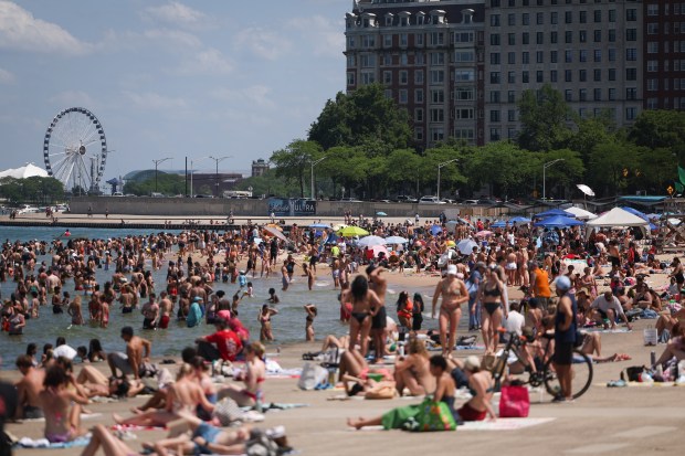 Hundreds of people enjoy the summer heat at Oak Street...