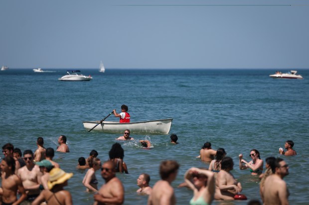 A lifeguard monitors the water at Oak Street Beach on...