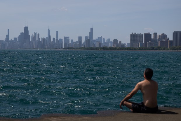 Diego Santos meditates by the pier at Montrose Beach on...