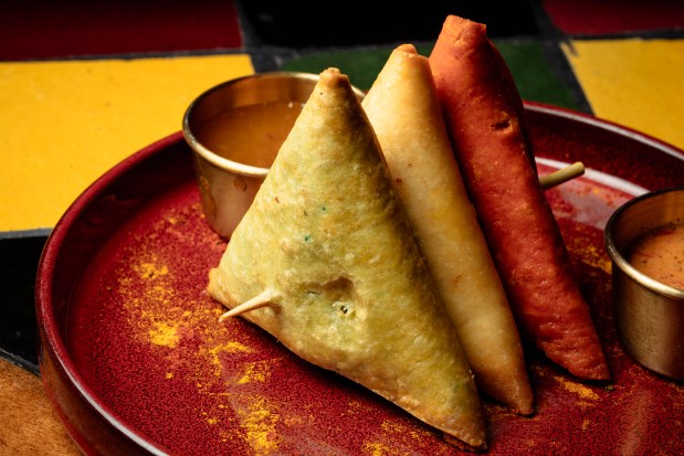 The sambusa trio, filled with spicy beef, pulled chicken or fine lentils, at Mahari. (E. Jason Wambsgans/Chicago Tribune)
