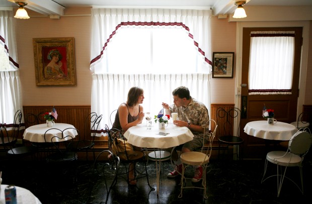 Ann Marie Borek and Michael Paulukonis enjoy sundaes at The Washington House Museum in the tiny Wisconsin town of Two Rivers on July 5, 2006. The store inside the museum is a replica of Berners' Ice Cream Parlor, believed to be the birthplace of the ice cream sundae in 1881. (E. Jason Wambsgans/Chicago Tribune) 