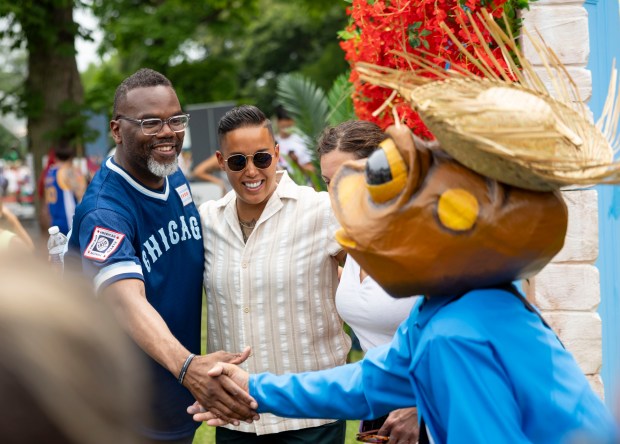 Mayor Brandon Johnson greets people Sunday, July 13, 2025, during the 25th annual Barrio Arts Festival at the National Puerto Rican Museum in Humboldt Park. (Brian Cassella/Chicago Tribune)