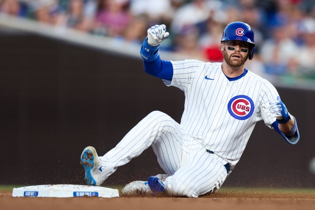 Cubs catcher Carson Kelly slides into second base during the fourth inning against the Guardians on Tuesday, July 1, 2025, at Wrigley Field. (Armando L. Sanchez/Chicago Tribune)