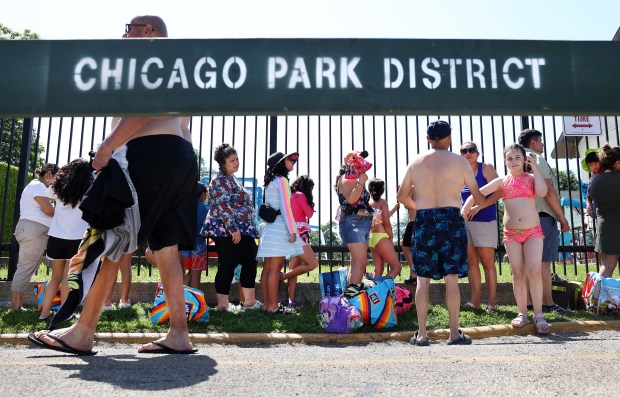 Stephanie Perez, 6, waits with her family for the McKinley...