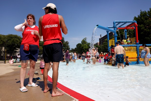 Lifeguards work the kiddie pool at McKinley Park on Chicago’s...