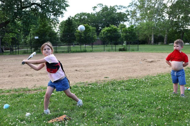 Judah Kruger, right, 4, looks on as his sister Amelia,...