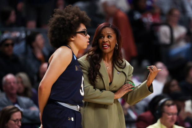 Notre Dame coach Niele Ivey, right, speaks with guard Olivia Miles during the fourth quarter against TCU in the Sweet 16 of the NCAA Tournament at Legacy Arena in Birmingham, Ala., on March 29, 2025. (Eileen T. Meslar/Chicago Tribune)